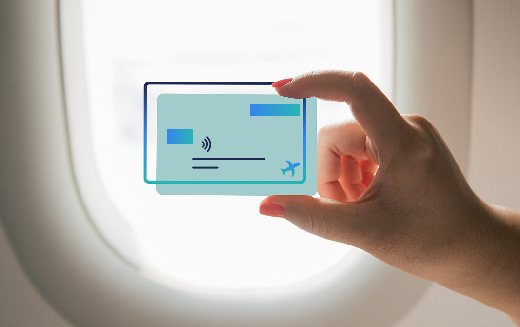 Traveler holding a card by an airplane window