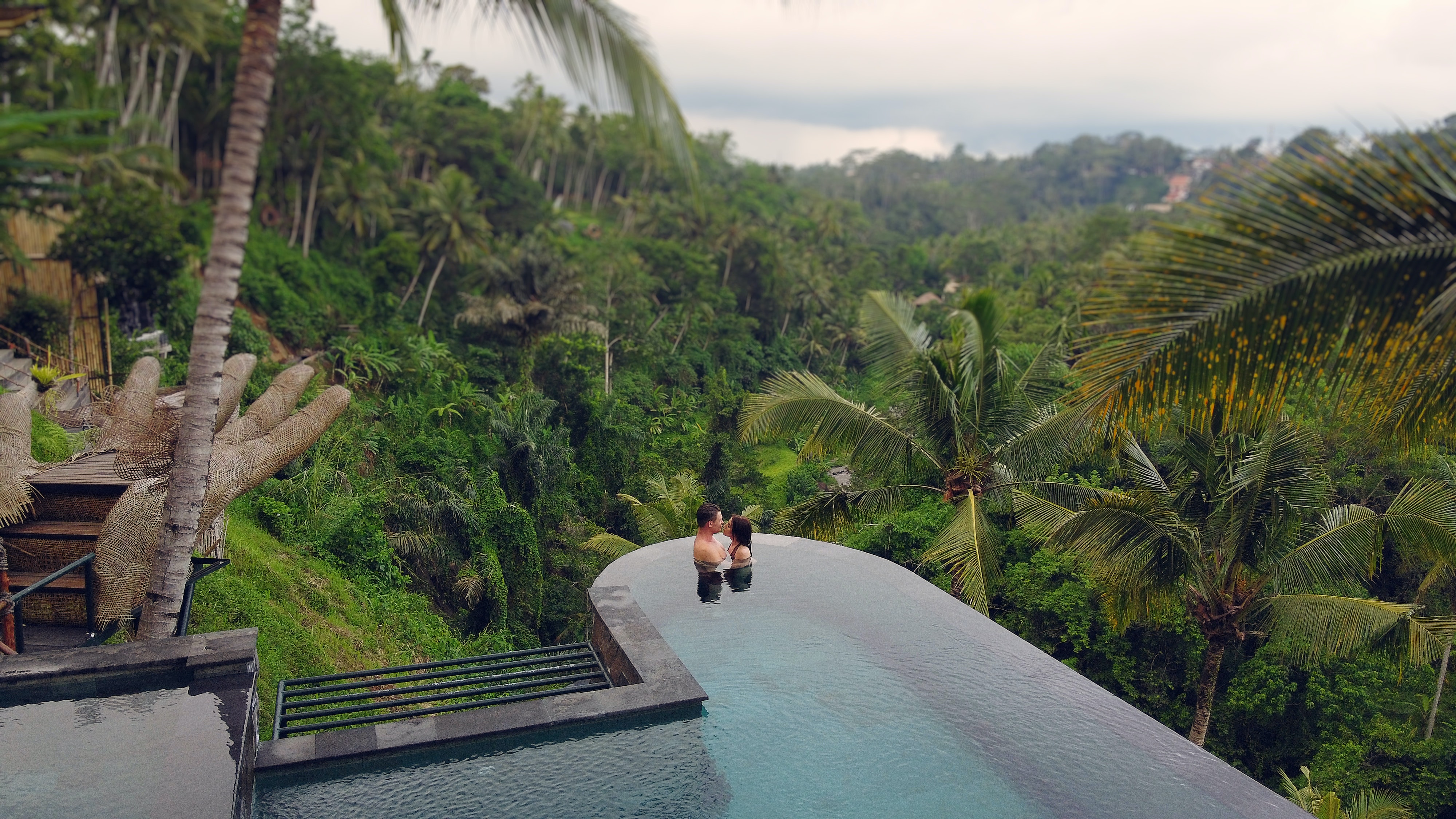 A couple in a pool in the rainforest